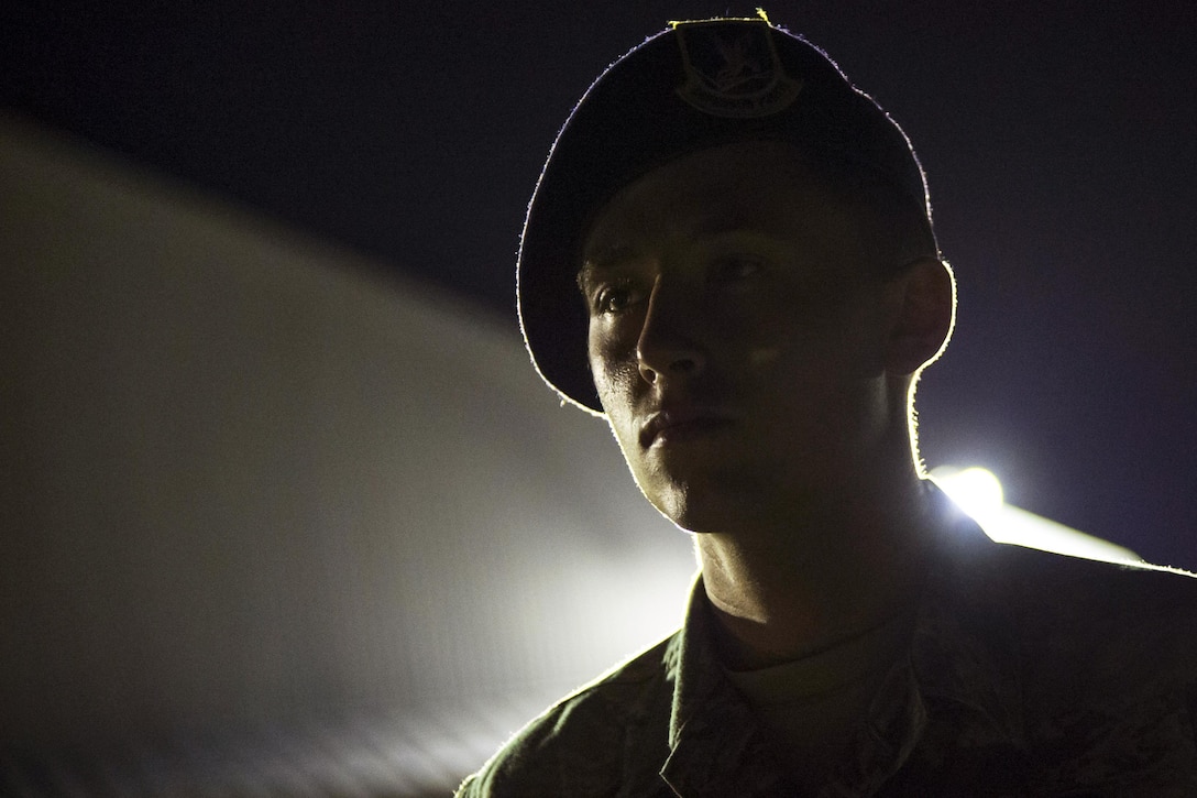 Air Force Senior Airman Brandon Rains stands guard during a night shift at Chitose Air Base, Japan, July 23, 2017. Rains is a base defense operations controller assigned to the 35th Security Forces Squadron. Air Force Staff Sgt. Deana Heitzman