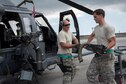 U.S. Air Force Senior Airman Zachary Hough and Staff Sgt. Ryan Anderson, 33rd Helicopter Maintenance Unit weapons section weapons load technicians, load a GAU-18 50-caliber machine gun onto an HH-60 Pave Hawk from the 33rd Rescue Squadron July 26, 2017, at Kadena Air Base, Japan. The 33rd RQS plays a vital part in maintaining peace and stability in the Pacific Region by providing forward power projection as well as search, rescue and recovery mission capabilities. (U.S. Air Force photo by Senior Airman John Linzmeier)