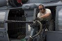 U.S. Air Force Tech. Sgt. Josean Arce, 33rd Helicopter Maintenance Unit weapons section weapons expediter, performs a systems check on a GAU-18 50-caliber machine gun mounted to an HH-60 Pave Hawk from the 33rd Rescue Squadron July 26, 2017, at Kadena Air Base, Japan. Airmen in the weapons section maintain, install, remove and safeguard all armaments and items associated with the HH-60 gun mounting and ammunition handling systems for the 33rd Rescue Squadron. (U.S. Air Force photo by Senior Airman John Linzmeier)