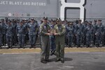 170725-N-GB595-062
SAN DIEGO (July 25, 2017) Commander, Naval Air Forces Vice Adm. Mike Shoemaker, right, presents the Admiral James H. Flatley Memorial Award to USS Makin Island (LHD 8) Commanding Officer Capt. Mark Melson during a ceremony on the ship’s flight deck.  Makin Island and the 11th Marine Expeditionary Unit received the award for excellence in aviation safety.  Makin Island is homeported in San Diego, and is preparing for an upcoming maintenance availability. (U.S. Navy photo by Mass Communication Specialist 1st Class Mathew Diendorf)