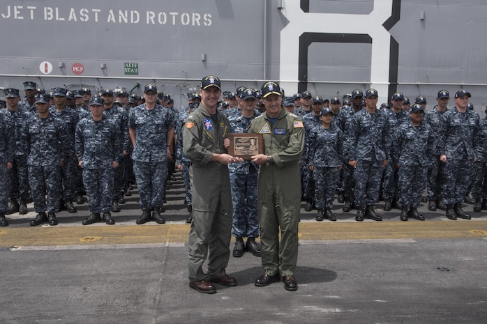 170725-N-GB595-062
SAN DIEGO (July 25, 2017) Commander, Naval Air Forces Vice Adm. Mike Shoemaker, right, presents the Admiral James H. Flatley Memorial Award to USS Makin Island (LHD 8) Commanding Officer Capt. Mark Melson during a ceremony on the ship’s flight deck.  Makin Island and the 11th Marine Expeditionary Unit received the award for excellence in aviation safety.  Makin Island is homeported in San Diego, and is preparing for an upcoming maintenance availability. (U.S. Navy photo by Mass Communication Specialist 1st Class Mathew Diendorf)