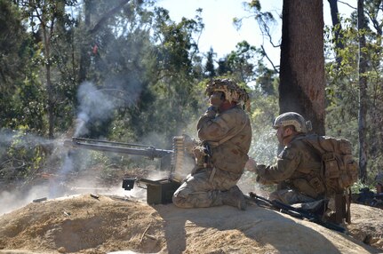 Soldiers from Charlie Company, 1st Battalion 69th Infantry, New York Army National Guard fire a M2 .50 caliber machine gun as members of Red Force during the final battle of Exercise Talisman Saber at the Shoalwater Bay Training Area, Queensland, Australia, on July 19, 2017. ( U.S. Army National Guard photo by Sgt. Michael Tietjen.)