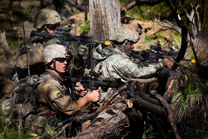 Members of the 1st Battalion 69th Infantry Regiment New York Army National Guard, acting as OPFOR defend their ground against Battlegroup Coral during the final assault at the Shoalwater Bay Training Area during Exercise Talisman Saber on 20 July, 2017. (Australian Defence Force photo by Cpl. Mark Doran)