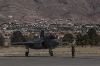 A pilot with Marine Fighter Attack Squadron (VMFA) 211 “Wake Island Avengers,” 3rd Marine Aircraft Wing, signals to a ground crew member after landing at Nellis Air Force Base, Nev., July 5. A total of 10 F-35B Lightning IIs and 250 Marines with VMFA-211 participated in Red Flag 17-3, a realistic combat training exercise hosted by the U.S. Air Force, to assess the squadron’s ability to deploy and support contingency operations using the F-35B. (U.S. Marine Corps photo by Sgt. Lillian Stephens/Released)