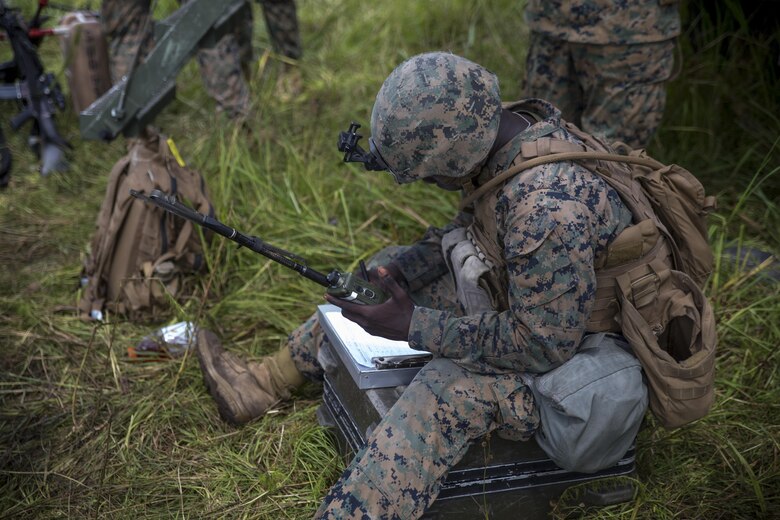 A Marine documents a call-for-fire during a live-fire range at Camp Lejeune, N.C., July 26, 2017. The purpose of this field operation is to test and improve the unit’s capabilities by putting the Marines into a simulated combat environment. The Marine is with 1st Battalion, 10th Marine Regiment. (U.S. Marine Corps photo by Lance Cpl. Holly Pernell)