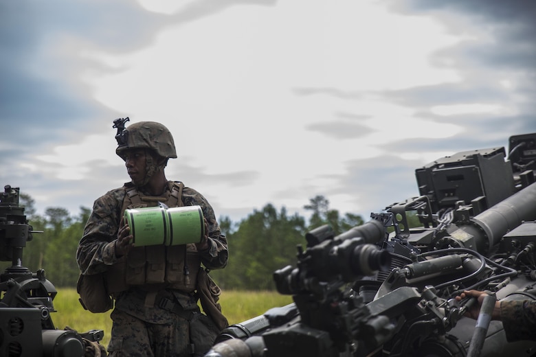 A Marine prepares to load the charge into an M777A2 Howitzer during a live-fire range at Camp Lejeune, N.C., July 26, 2017. The purpose of this field operation is to test and improve the unit’s capabilities by putting the Marines into a simulated combat environment. The Marine is with 1st Battalion, 10th Marine Regiment. (U.S. Marine Corps photo by Lance Cpl. Holly Pernell) 