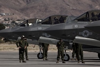 A pilot with Marine Fighter Attack Squadron (VMFA) 211 “Wake Island Avengers,” 3rd Marine Aircraft Wing, signals to a ground crew member after landing at Nellis Air Force Base, Nev., July 5. A total of 10 F-35B Lightning IIs and 250 Marines with VMFA-211 participated in Red Flag 17-3, a realistic combat training exercise hosted by the U.S. Air Force, to assess the squadron’s ability to deploy and support contingency operations using the F-35B. (U.S. Marine Corps photo by Sgt. Lillian Stephens/Released)