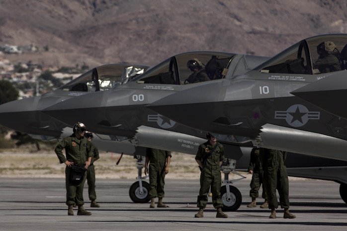 A pilot with Marine Fighter Attack Squadron (VMFA) 211 “Wake Island Avengers,” 3rd Marine Aircraft Wing, signals to a ground crew member after landing at Nellis Air Force Base, Nev., July 5. A total of 10 F-35B Lightning IIs and 250 Marines with VMFA-211 participated in Red Flag 17-3, a realistic combat training exercise hosted by the U.S. Air Force, to assess the squadron’s ability to deploy and support contingency operations using the F-35B. (U.S. Marine Corps photo by Sgt. Lillian Stephens/Released)