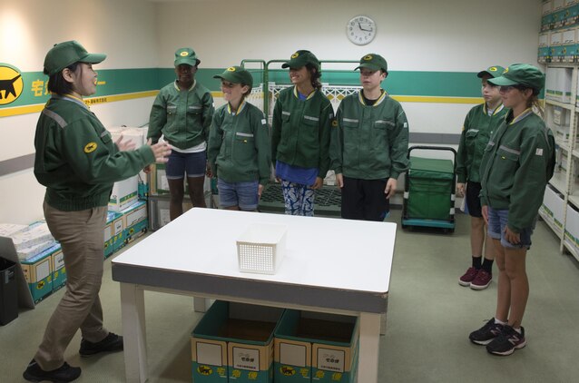 Children from Marine Corps Air Station Iwakuni role-play as couriers during a trip with the Youth and Teen Center to Kidzania in Kobe, Japan, July 26, 2017. Kidzania is an indoor education entertainment center that provides children the interactive experience of working adult jobs and earning currency. Children are able to dress up and role-play as adults in nearly 100 jobs and activities with each profession offering the chance to use life-like tools and equipment. (U.S. Marine Corps photo by Lance Cpl. Carlos Jimenez)