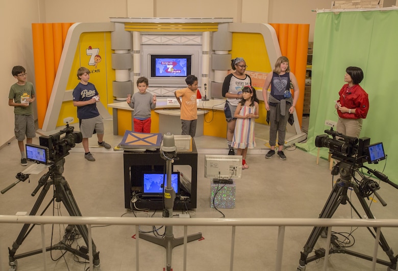 Youth and Teen Center members from Marine Corps Air Station Iwakuni role-play as news anchors and cameramen during a trip to Kidzania in Kobe, Japan, July 26, 2017. Kidzania is an indoor education entertainment center that provides children the interactive experience of working adult jobs and earning currency. A Youth and Teen Center staff member said the purpose of the trip was to give the children the opportunity to participate in Japanese culture and interact with Japanese children. (U.S. Marine Corps photo by Lance Cpl. Carlos Jimenez)