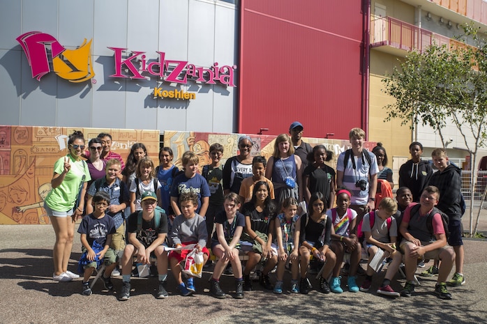 Marine Corps Air Station Iwakuni residents pose for a photo outside of Kidzania in Kobe, Japan, July 26, 2017, as part of a Youth and Teen Center trip. The trip marks the first time the Youth and Teen Center visited the theme park. The Youth and Teen Center often takes trips to popular destinations and offers a variety of events and services. (U.S. Marine Corps photo by Lance Cpl. Carlos Jimenez)