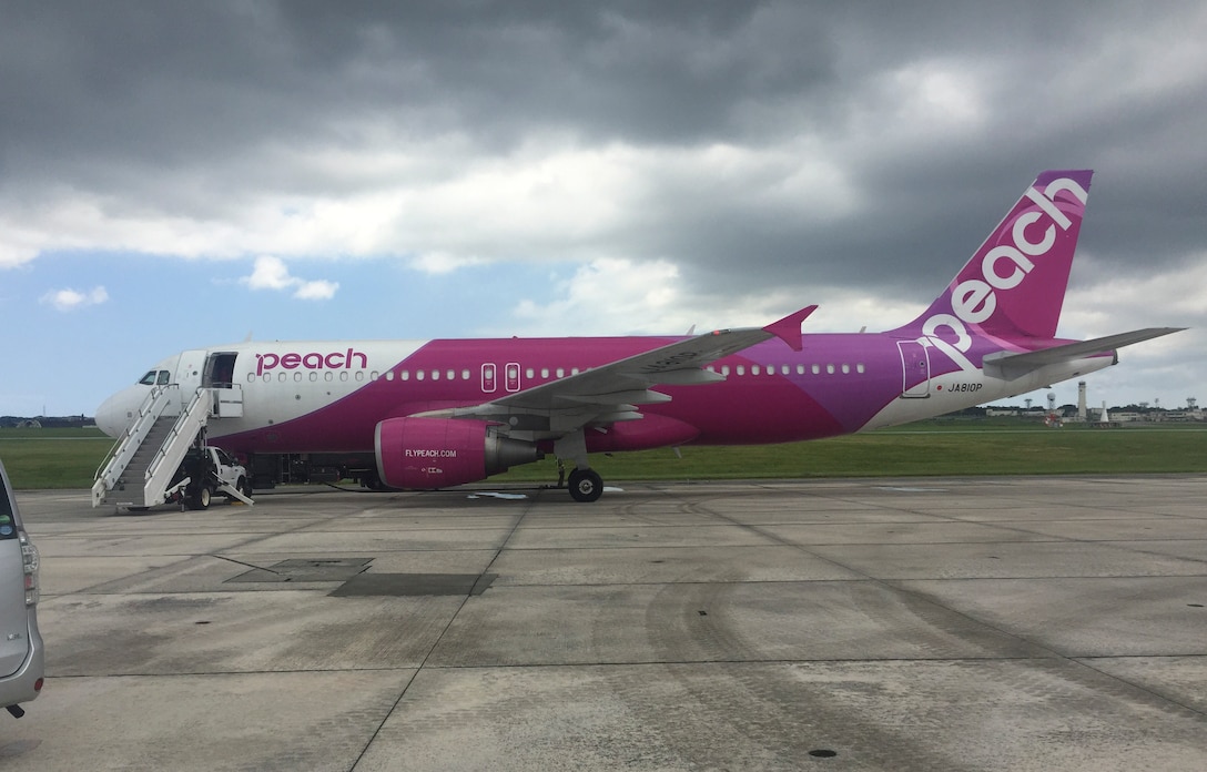 A Peach Aviation Airbus A320 passenger plane receives fuel from the 18th Logistics Readiness Squadron fuels management flight July 26, 2017, at Kadena Air Base, Japan.  Shogun Airmen supported and serviced the diverted A320 and another 11 Japanese civil and military aircraft due to a runway closure at Naha Airport involving aircraft malfunction. (U.S. Air Force photo by Master Sgt. Dustin Troyer)