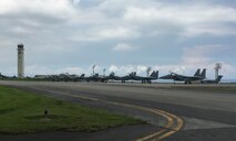 Japan Air Self-Defense Force F-15 Eagles standby for fuel July 26, 2017, at Kadena Air Base, Japan. The JASDF fighters diverted to Kadena for assistance when Naha Airport, their home station, closed its runway due to an aircraft malfunction incident. (U.S. Air Force photo by Master Sgt. Dustin Troyer)