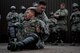 U.S. Air Force Staff Sgt. Joshua Smith, 86th Security Forces Squadron instructor, prepares to lift U.S. Air Force Senior Airman Vance Listwan, 86th SFS police services assistant, during confrontational management training at the 86th SFS training section on Ramstein Air Base, Germany, July 25, 2017. Smith demonstrated how to properly detain someone using flex cuffs and techniques to maintain control. (U.S. Air Force photo by Senior Airman Devin Boyer)