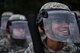 U.S. Air Force Airman 1st Class Joshua Graniel-Sablan, 86th Security Forces member, smiles through his visor during confrontational management training at the 86th SFS training section on Ramstein Air Base, Germany, July 25, 2017. Despite the rain, Graniel-Sablan and his fellow Airmen laughed and smiled as they pushed through the training. (U.S. Air Force photo by Senior Airman Devin Boyer)