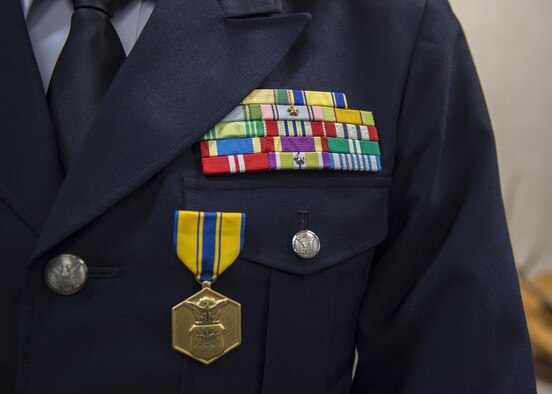 The U.S. Air Force Commendation Medal rests on the chest of Japan Air Self-Defense Force Col. Shunichi Araki, the Northern Aircraft Control and Warning Wing vice commander, after it was presented at Misawa Air Base, Japan, July 27, 2017. Araki received this medal for his actions during his tenure at Yokota Air Base, Japan, as Operations Support Wing, Air Defense Command vice commander. His accomplishments included being a key asset during the Yokota Friendship Festival, exercise KEEN EDGE and enhancing bilateral partnerships among the U.S. and Japan. (U.S. Air Force photo by Staff Sgt. Deana Heitzman)
