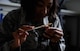 Airman 1st Class Arielle Howze, 786th Civil Engineer Squadron pest management journeyman, fills a mouse trap with peanut butter on Ramstein Air Base, Germany, July 27, 2017. Snap traps with peanut butter bait are very effective in killing mice and rats. Bait boxes with chemicals inside are used when there is a large population suspected. (U.S. Air Force Airman 1st Class Savannah L. Waters)