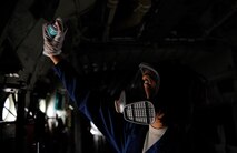 Airman 1st Class Arielle Howze, 786th Civil Engineer Squadron pest management journeyman, sprays aircraft insecticide inside a C-130 Hercules on Ramstein Air Base, Germany, July 27, 2017. Depending on the size of the aircraft, the spray needs anywhere from 30 minutes to an hour for aircraft treatment. (U.S. Air Force Airman 1st Class Savannah L. Waters)