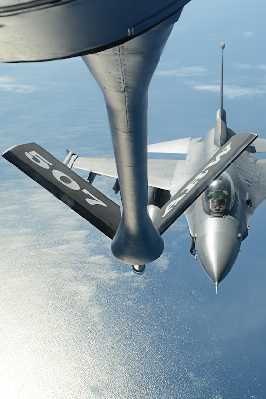 Reserve Citizen Airmen from the 465th Air Refueling Squadron at Tinker Air Force Base, Okla., deliver fuel to an F-16 Fighting Falcon from Spangdahlem Air Base, Germany, July 25, 2017. In a long-standing partnership between the Air Force Reserve Command and U.S. Air Forces in Europe, members of the 507th Air Refueling Wing augmented the 100th Air Refueling Wing July 1-29, 2017, to provide KC-135R Stratotanker air refueling support to the European theater of operations. (U.S. Air Force photo/Tech Sgt. Lauren Gleason)