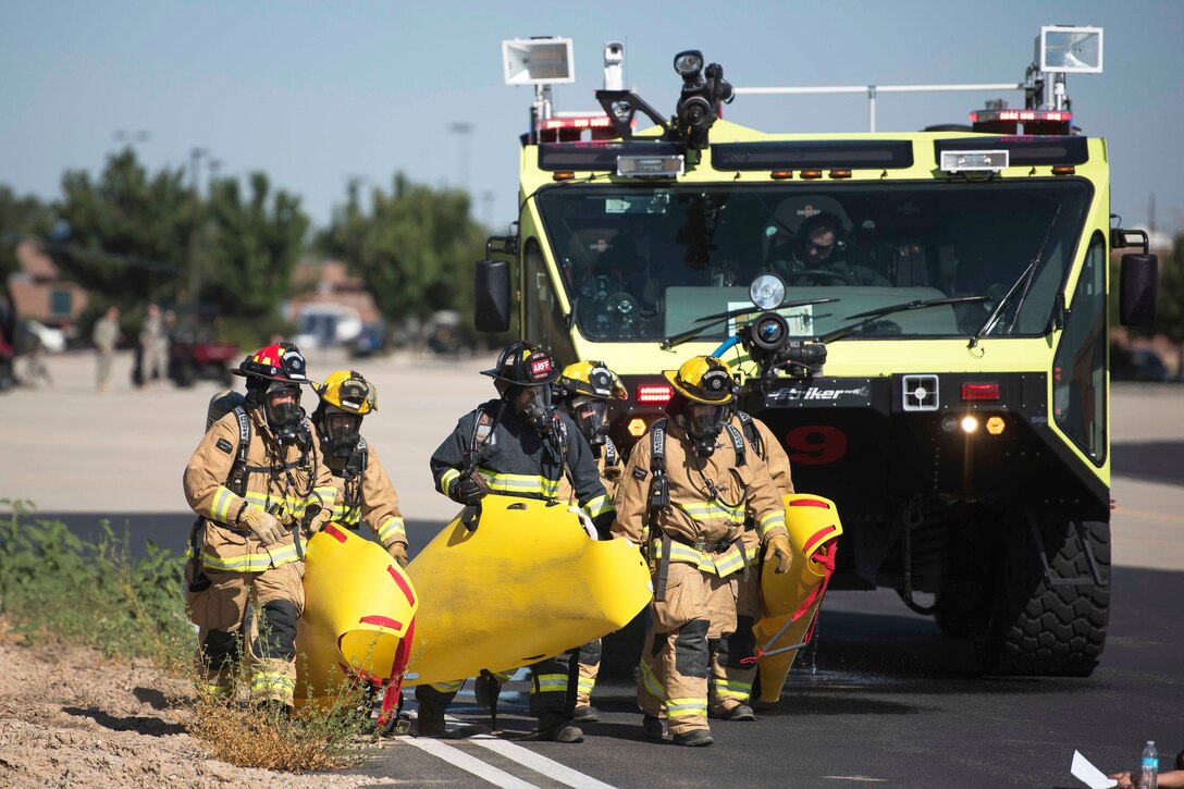 Idaho National Guard soldiers and airmen participate in a major accident response exercise with first responders at Gowen Field in Boise, Idaho, July 21, 2017. Air National Guard photo by Tech. Sgt. John Winn