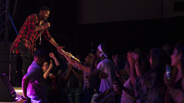 Orville Burrell, better known as “Shaggy,” a musical artist and Marine Corps veteran, interacts with his fans during a live concert at Marine Corps Air Station Iwakuni, Japan, July 26, 2017. Shaggy sang a variety of his hit songs including “Boombastic,” “It Wasn’t Me” and “Oh Carolina.” The concert was part of an Armed Forces Entertainment tour that included three military installations across Japan. (U.S. Marine Corps photo by Cpl. Donato Maffin)
