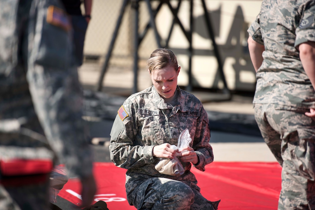 An Idaho Army National Guardsman prepares medical supplies for use on mock casualties during a major accident response exercise at Gowen Field in Boise, Idaho, July 21, 2017. Air National Guard photo by Tech. Sgt. John Winn