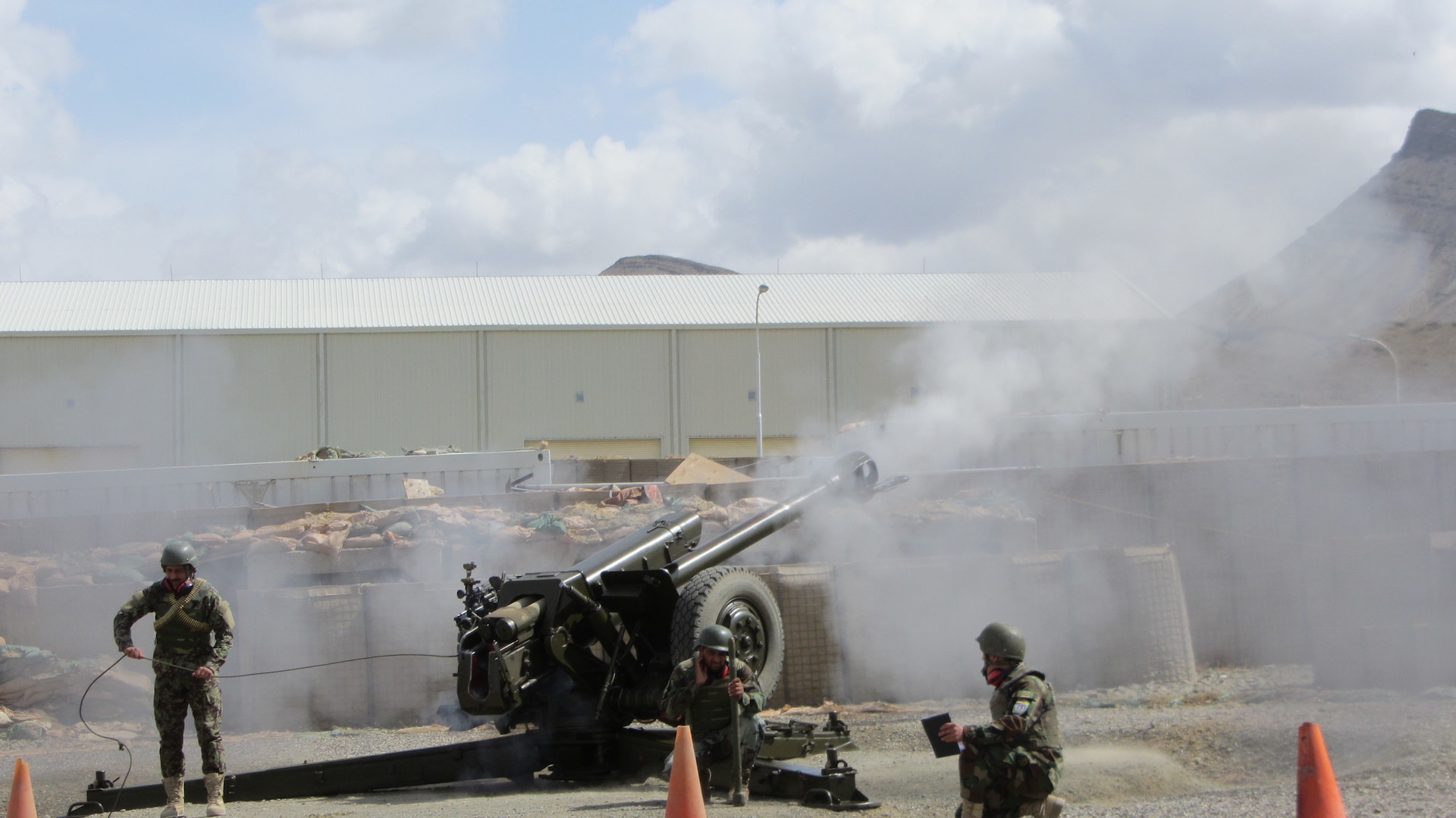 An artillery crew from the Afghan National Army 203rd Thunder Corps conduct a live fire training on a D30 122mm Artillery weapon system at FOB Thunder in Gardez, Afghanistan. (Afghanistan National Army photo provided by 203rd Police Zone PAO.)