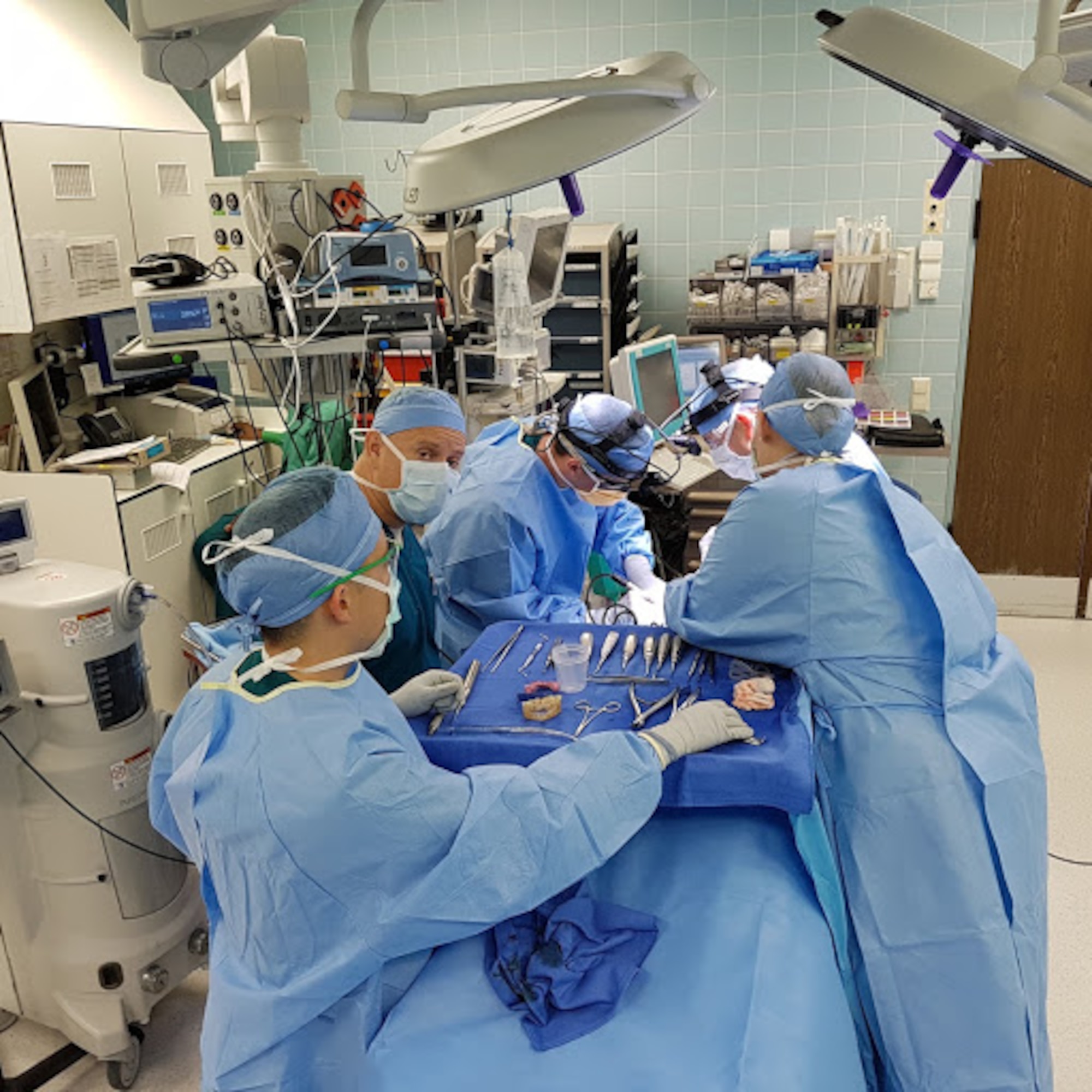 A dental rapid response team works quickly to repair dental trauma at Landstuhl Regional Medical Center, Germany, July 6, 2017. The 86th Dental Squadron and LRMC team up their skills and resources to cut recovery time for dental trauma patients by 75 percent. (Courtesy photo)