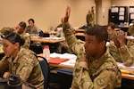 N.Y. Army National Guard Soldier, Julio Fernandez, assigned 1st Battalion, 258th Field Artillery, asks a question during a class in the Future Leader Course, on the Camp Smith Training Site, Cortlandt Manor, N.Y., July 19, 2017. The course covers all the basic skills Soldiers need to be effective leaders, such as tactical movements, land navigation, marksmanship, and reacting to enemy fire.The training was part of the New York Army National Guard's Future Leaders Course, a pilot program aimed at preparing Soldiers to become NCOs. 