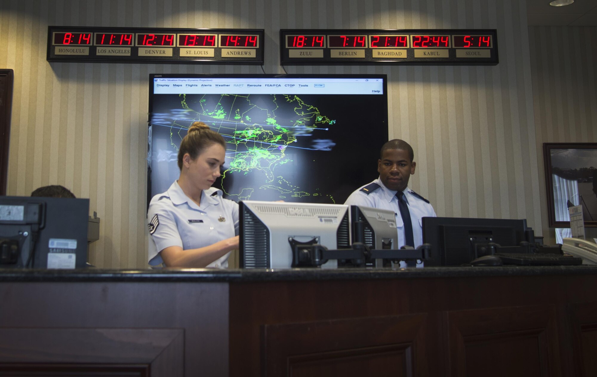 Staff Sgt. Katy McGlone, 89th Airlift Wing flight line protocol NCO in charge and 2nd Lt. Stephan Jenkins, 89th Airlift Wing flight line protocol officer, prepare for a distinguished visitors arrival at Joint Base Andrews, Md., June 22, 2017. These Airmen directly support the president, vice president, first lady, secretary of defense, secretary of state, chairman of the joint Chiefs of Staff, and foreign dignitaries. 
