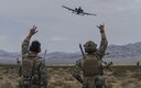 Joint terminal attack controllers wave at an A-10 Thunderbolt II attack aircraft during a show of force on the Nevada Test and Training Range July 19, 2017. The A-10 has excellent maneuverability at low air speeds and low-altitude, and is a highly accurate weapons delivery platform. (U.S. Air Force photo/Senior Airman Kevin Tanenbaum)