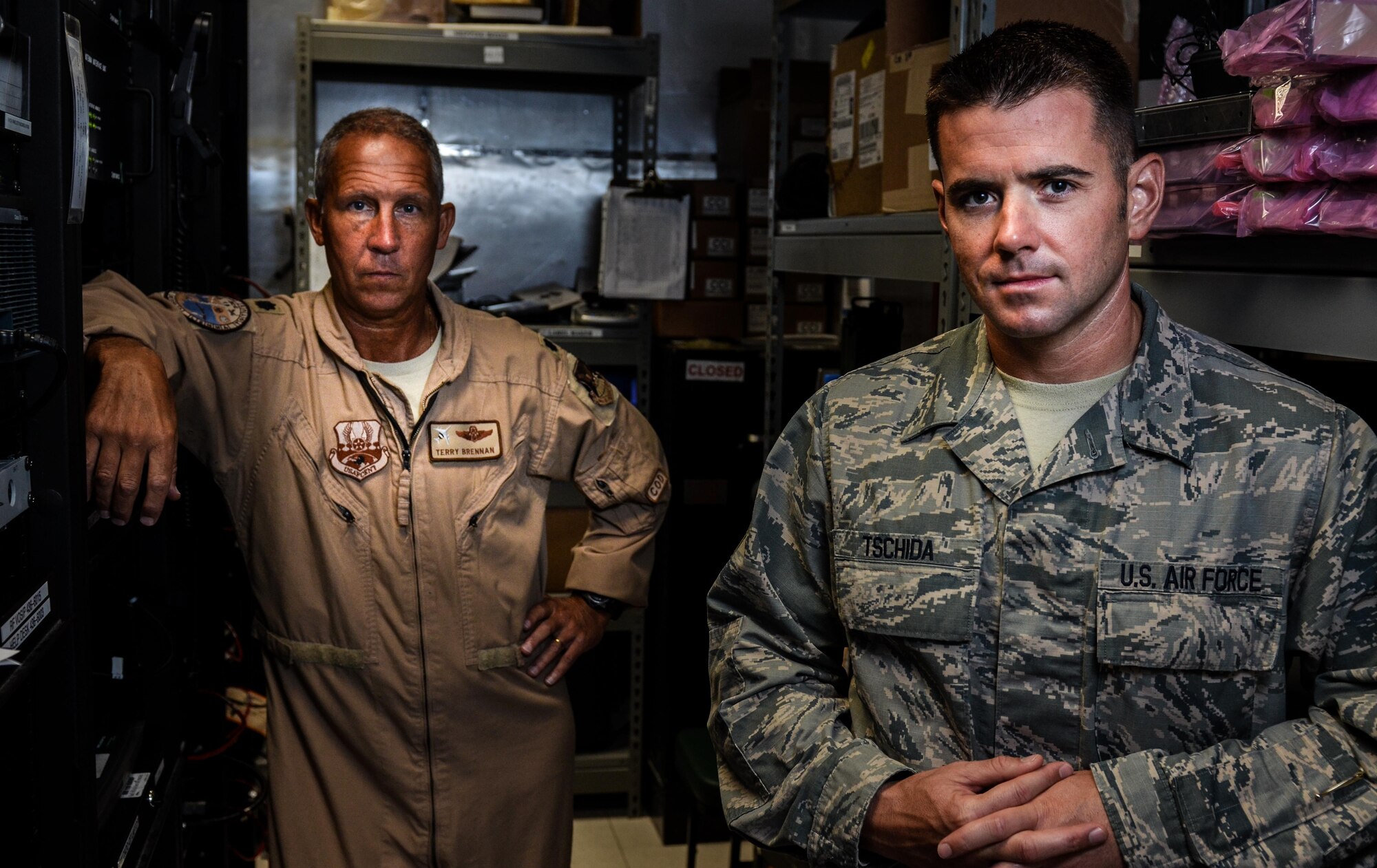 Master Sgt. Kyle Tschida, a Joint Interface Control cell watch officer with the 609th Air Operations Center, right, and Lt. Col. Terry Brennan, deputy U.S. Air Forces Central Command JIC officer, stand for a photo July 21, 2017, at the Combined Air Operations Center on Al Udeid Air Base, Qatar. Brennan led a team that re-engineered theater data link architecture and provided reliable connectivity and responsive data link message traffic for the warfighter. (U.S. Air Force photo by Staff Sgt. Alexander Riedel)