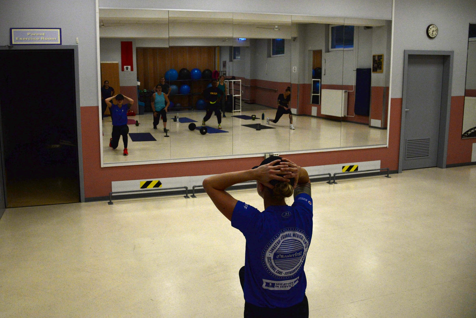 Senior Airman Lesley Colletta, 86th Medical Squadron pharmacy technician, leads a physical training session July 27, 2017, at the Landstuhl Fitness Center. Working with limited equipment, Colletta’s fitness course primarily uses body weight exercises coupled with a high-intensity interval training method to get the most out of the workout. (U.S. Air Force photo by Airman 1st Class D. Blake Browning)