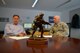 A trophy for the 86th Airlift Wing Plans and Programs Office stands in the middle of a table during a meeting on Ramstein Air Base, Germany, July 26, 2017. 86th AW XP integrates information and creates solutions concerning missions and operations coming in and out of Ramstein. The office acts as a liaison between incoming missions and the agencies they need to meet. (U.S. Air Force photo by Airman 1st Class Joshua Magbanua) 