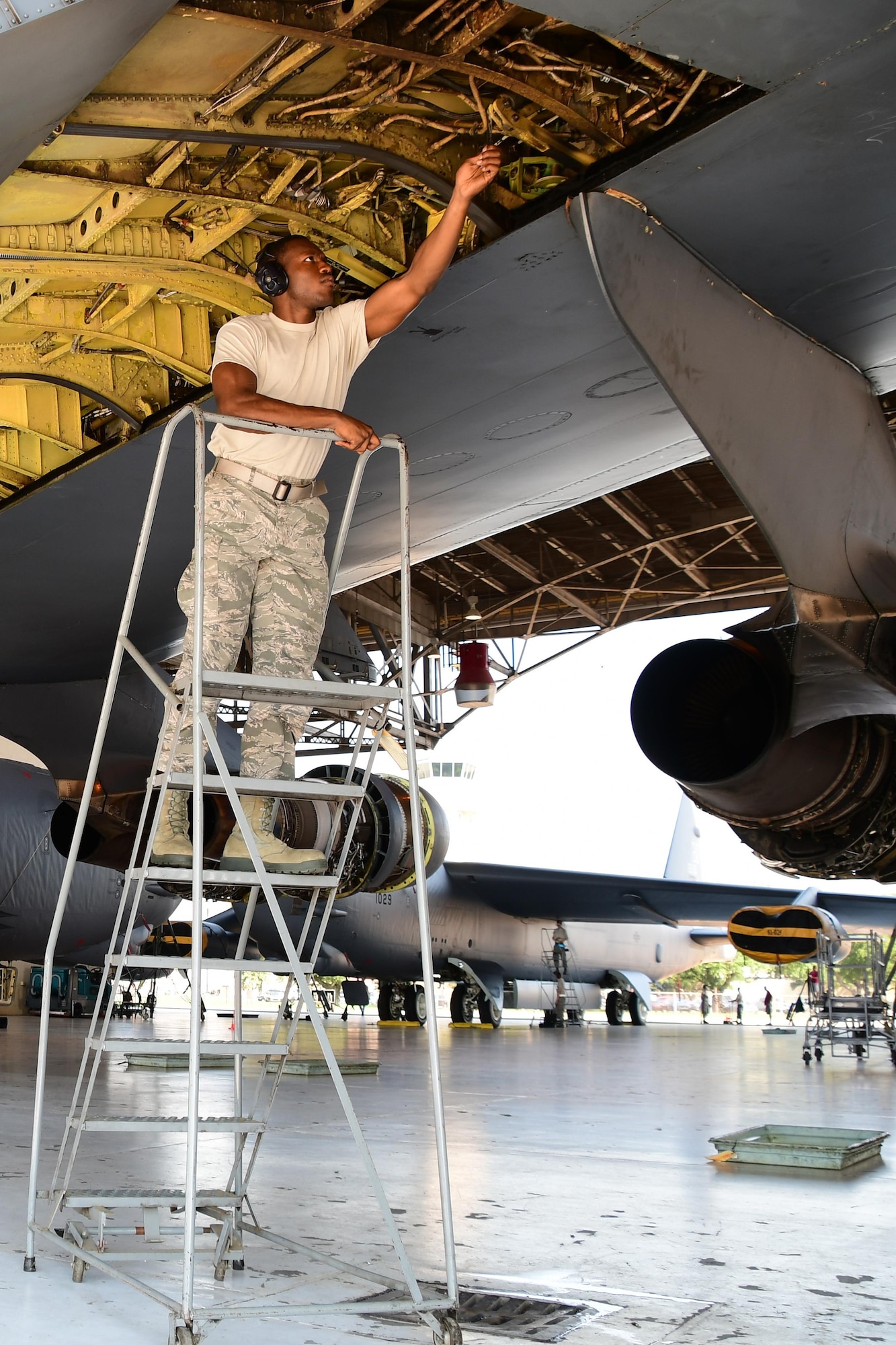 Airman First Class Jonathan Shepherd, an aircraft hydraulic systems specialist assigned to the 307th Maintenance Squadron, makes adjustments to the wing hydraulic system of a B-52 Stratofortress during a phase inspection on Barksdale Air Force Base, La. June 28, 2017. Shepherd is making the adjustment to the system after a line was replaced during a phase inspection of the bomber. (U.S. Air Force photo by Master Sgt. Dachelle Melville/Released)