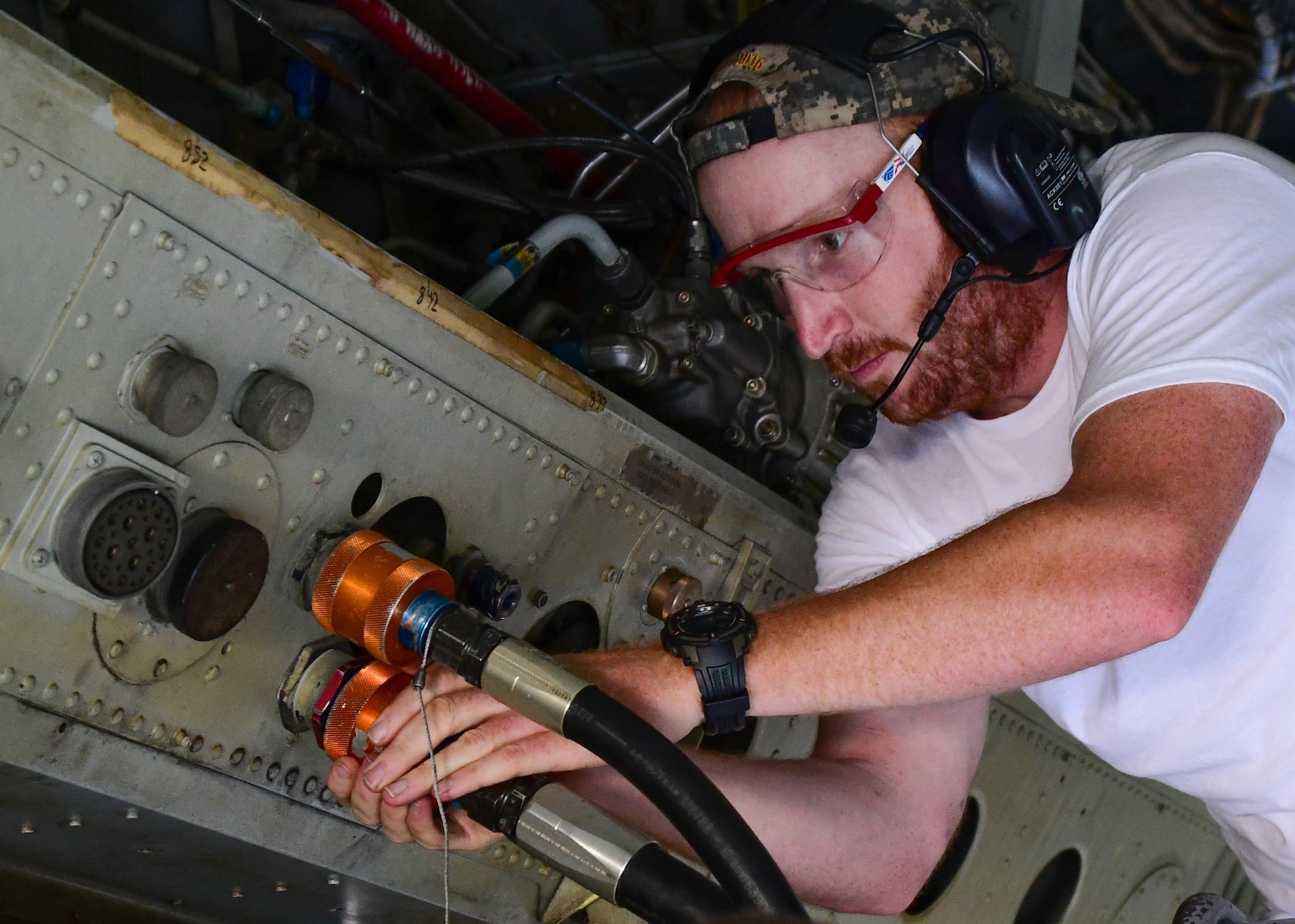 Staff Sgt. Brian Vermillion, assigned to the 307th Maintenance Squadron, attaches hydraulic tester to the hydraulic system inside the bomb bay of a B-52 Stratofortress during a phase inspection on Barksdale Air Force Base, La. June 28, 2017. The testing of the hydraulic system is part of the phase inspection of the B-52 that must be performed every 450 flight hours. (U.S. Air Force photo by Master Sgt. Dachelle Melville/Released)