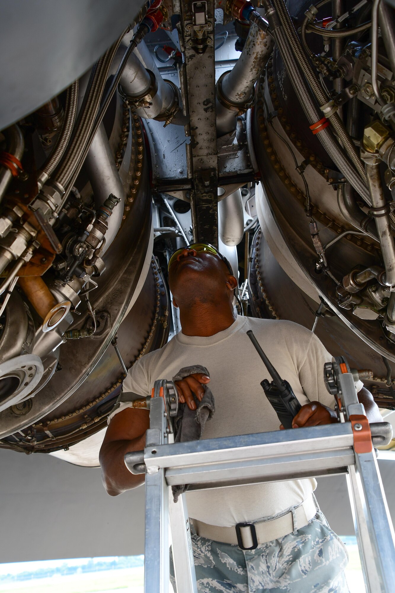 Master Sgt. Ron Harris, assigned to the 307th Maintenance Squadron, checks for leaks on two engines of a B-52 Stratofortress prior to performing an engine run on Barksdale Air Force Base, La. June 29, 2017. All eight Pratt and Whitney Turbofan Engines are carefully inspected before the bomber is returned to service after a phase inspection. (U.S. Air Force photo by Master Sgt. Dachelle Melville/Released)