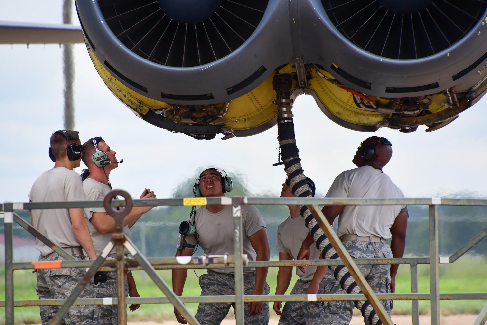 Airmen assigned to the 307th Maintenance Squadron inspect the running engines a B-52 Stratofortress for leaks on Barksdale Air Force Base, La. June 29, 2017. The engine run is one of the final parts of a phase inspection of the bomber and multiple eyes are needed as well as valuable training is received by everyone helping out with the inspection. (U.S. Air Force photo by Master Sgt. Dachelle Melville/Released)