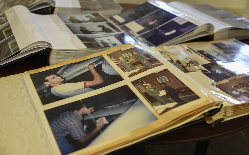Photo albums are displayed at the 457th Airlift Squadron 75th Anniversary celebration at Joint Base Andrews, Md., June 30, 2017. Former, inluding World War II and Vietnam War veterans, and current squadron members brought photos and mementos from their time in the unit to share. (U.S. Air Force photo by Airman 1st Class Rustie Kramer)
