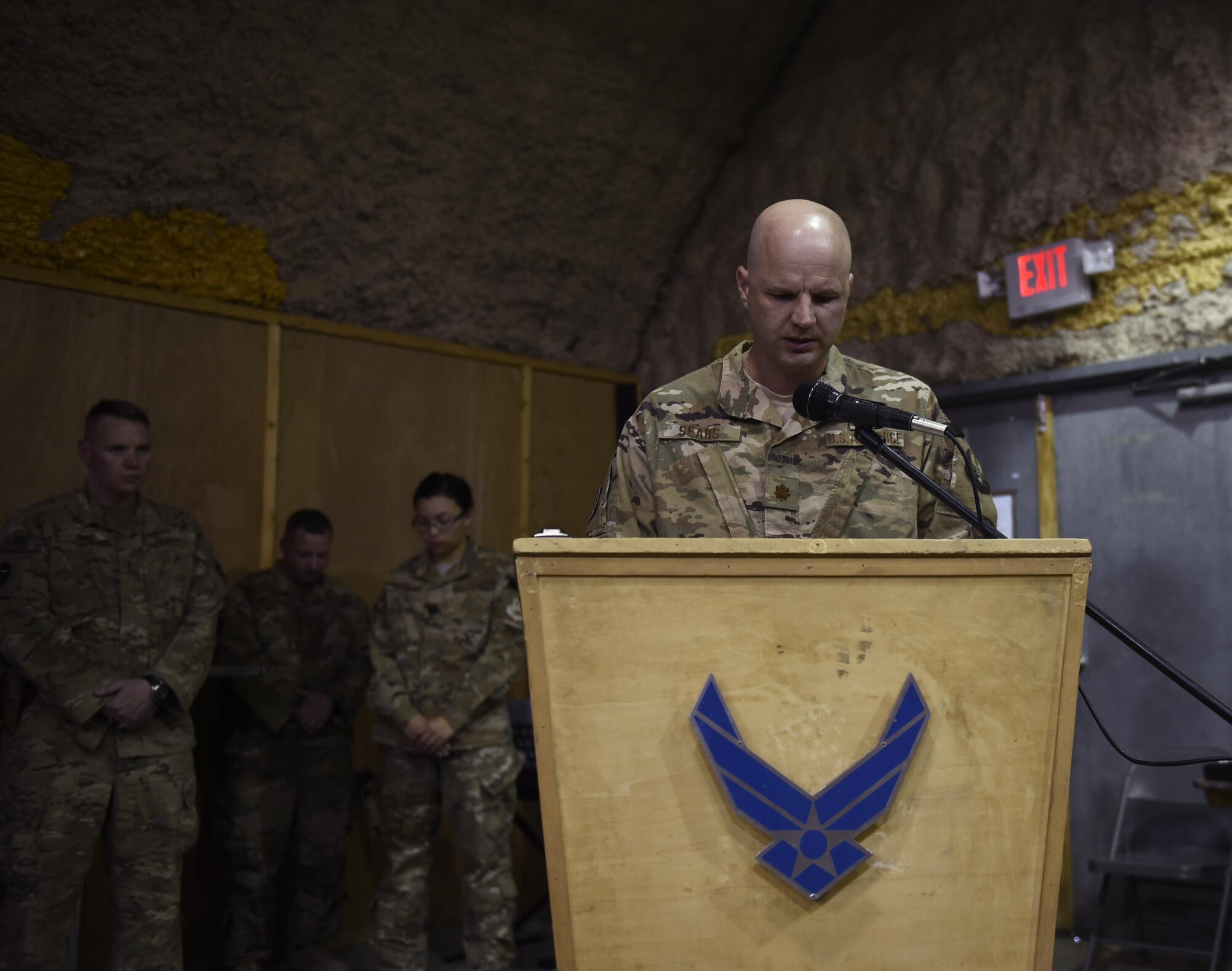 Chaplain (Maj.) Travis Sears, 451st Air Expeditionary Group, delivers an invocation during a ceremony at Kandahar Airfield, Afghanistan, June 23, 2017. Religious support teams from the 455th AEW provide spiritual support in seven locations in Afghanistan. (U.S. Air Force photo by Staff Sgt. Benjamin Gonsier)