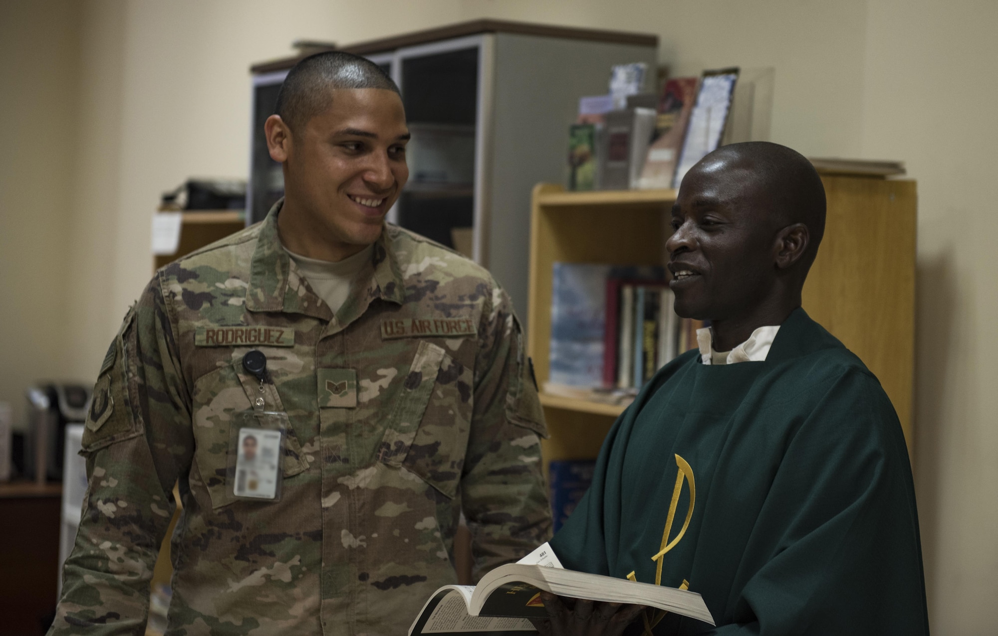Staff Sgt. Christopher Rodriguez, 455th Air Expeditionary Wing chaplain assistant, and Chaplain (Capt.) John Appiah, 455th AEW, discuss a religious service at Hamid Karzai International Airport, Kabul, Afghanistan, July 23, 2017. Religious support teams provide spiritual support to all members and find ways to meet the needs of individuals who do not have the resources to practice their faith in a deployed location. (U.S. Air Force photo by Staff Sgt. Benjamin Gonsier)