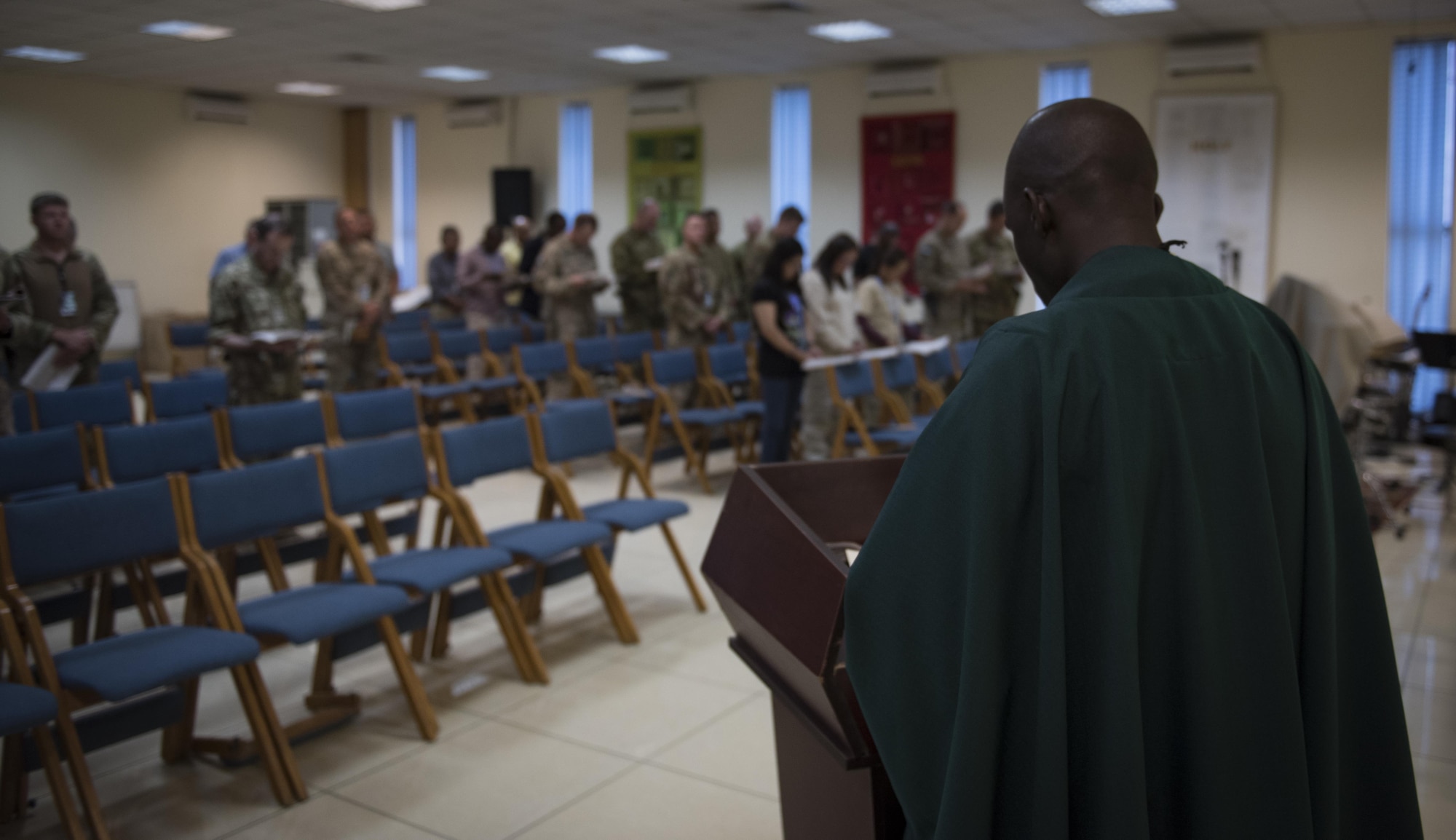 Chaplain (Capt.) John Appiah, 455th Air Expeditionary Wing, preaches during a religious service at Hamid Karzai International Airport, Kabul, Afghanistan, July 23, 2017. Religious support teams provide spiritual support to all members and find ways to meet the needs of individuals who do not have the resources to practice their faith in a deployed location. (U.S. Air Force photo by Staff Sgt. Benjamin Gonsier)
