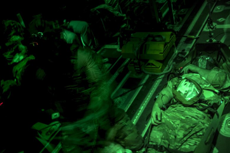 A 38th Rescue Squadron pararescueman assesses a patient's wounds during a simulated training, June 21, 2017, at Moody Air Force Base, Ga. The Air Force Research Laboratory from Wright-Patterson Air Force Base, Ohio and the Baltimore U.S. Air Force Center for Sustainment of Trauma and Readiness Skills, observed Moody's Combat Search and Rescue aeromedical patient processes and survival kit technology, in hopes of reducing risks to improve the overall Air Force mission. (U.S. Air Force photo by Staff Sgt. Ryan Callaghan) 