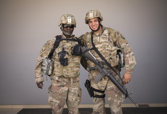 Chaplain (Capt.) John Appiah and Staff Sgt. Christopher Rodriguez, 455th Air Expeditionary Wing, prepare to leave Hamid Karzai International Airport, Kabul, July 23, 2017. Since chaplains are noncombatants, their assistants, though not trained bodyguards, take on the extra responsibility of defending their chaplain if in a hostile situation. (U.S. Air Force photo by Staff Sgt. Benjamin Gonsier) 
