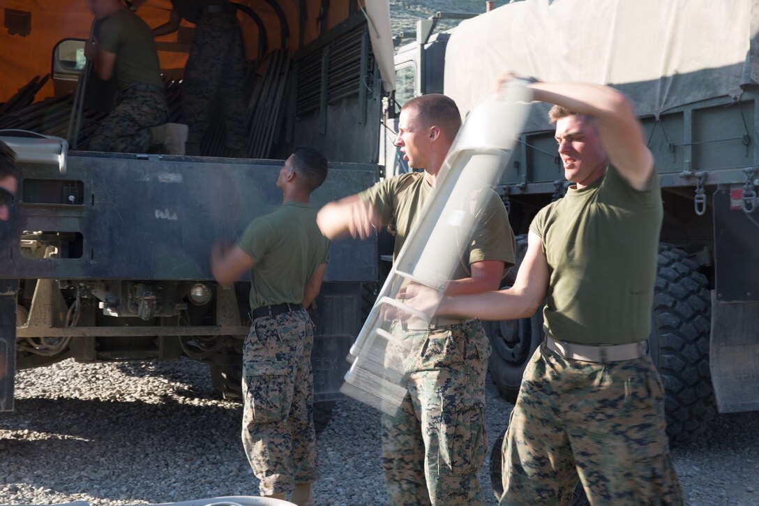 U.S. Marines with Combat Logistics Battalion 5 (CLB-5), Combat Logistics Regiment 1, 1st Marine Logistics Group, begin the construction an expeditionary mess hall during a training field exercise on the Marine Corps Mountain Warfare Training Center Bridgeport, Calif., June 14, 2017. CLB-5 supports the 2d Battalion, 8th Marine Regiment, 2d Marine Division, logistically by tackling the technical aspects of mountainous and cold weather operations by providing them chow, water, and fuel. (U.S. Marine Corps photo by Lance Cpl. Timothy Shoemaker)