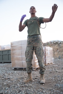 U.S. Marine Cpl. Shawn Pettway, a landing support specialist with Combat Logistics Battalion 5 (CLB-5), Combat Logistics Regiment 1, 1st Marine Logistics Group, directs his Marines to move a tent on the Marine Corps Mountain Warfare Training Center Bridgeport, Calif., June 14, 2017. CLB-5 supports the 2d Battalion, 8th Marine Regiment, 2d Marine Division, logistically by tackling the technical aspects of mountainous and cold weather operations by providing them chow, water, and fuel. (U.S. Marine Corps photo by Lance Cpl. Timothy Shoemaker)