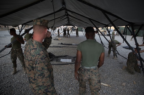 U.S. Marines with Combat Logistics Battalion 5 (CLB-5), Combat Logistics Regiment 1, 1st Marine Logistics Group, help form the foundation of an expeditionary mess hall on the Marine Corps Mountain Warfare Training Center in Bridgeport, Calif., June 14, 2017. CLB-5 supports the 2d Battalion, 8th Marine Regiment, 2d Marine Division, logistically by tackling the technical aspects of mountainous and cold weather operations by providing them chow, water, and fuel. (U.S. Marine Corps photo by Lance Cpl. Timothy Shoemaker)