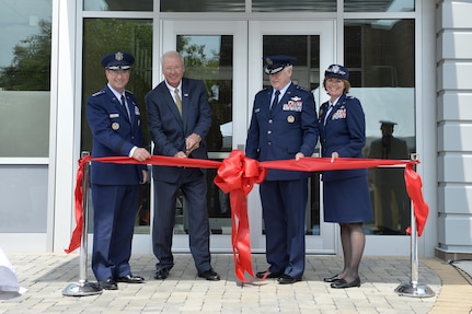 Gen. Joseph Lengyel, chief of the National Guard Bureau; retired Gen. Craig R. McKinley, national chair for the Employer Support of the Guard and Reserve for the Secretary of Defense; Lt. Gen. L. Scott Rice, director of the Air National Guard; and Col. Kerry Lovely, commander of the I.G. Brown Training and Education Center, cut the ribbon to Craig R. McKinley Hall, July 27, 2017, during a dedication ceremony on McGhee Tyson Air National Guard Base in East Tennessee. 