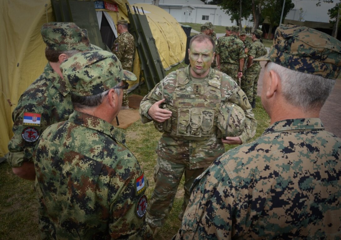 Army Lt. Gen. Ben Hodges, commanding general of U.S. Army Europe, speaks with Serbian medical professionals with the Balkan Medical Task Force during mass casualty medical training at Mihail Kogalniceanu Air Base, Romania, July 16, 2017. The training is part of exercise Saber Guardian 17, a U.S. Army Europe-led multinational exercise that spans across Bulgaria, Hungary and Romania with more than 25,000 service members from 22 allied and partner nations. Army photo by Sgt. Tyler Meister