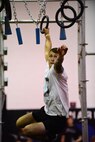 Senior Airman Kevin Brodbeck, a competitor from the 509th Maintenance Squadron, reaches for a ring during the Alpha Warrior Challenge at Whiteman Air Force Base, Mo.,
July 22, 2017. The challenge is an Air Force-level event where competitors face eight obstacles testing their physical and mental limits.